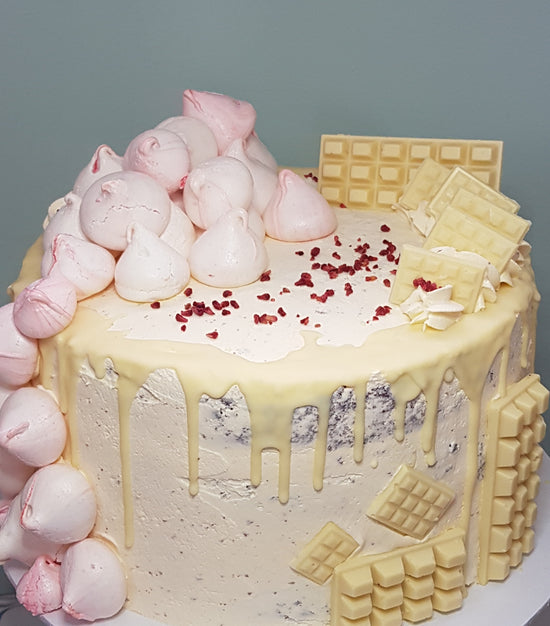 four layer red velvet cake with homemade mini chocolate bars