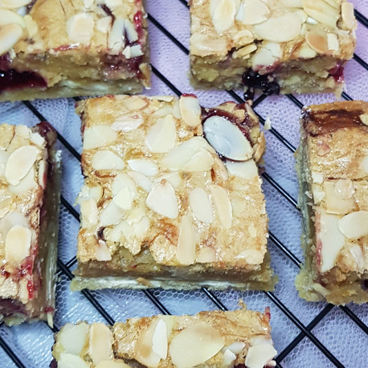 Bakewell Blondies with flaked almonds and homemade jam