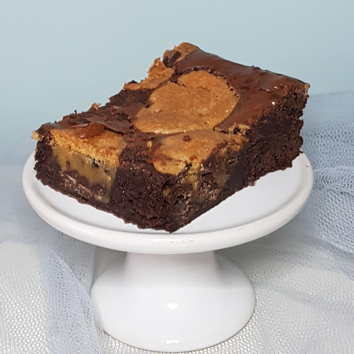 Cookie dough brownie on a ceramic stand